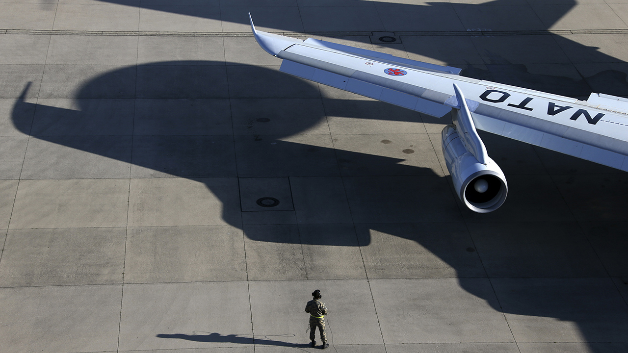 A NATO Airborne Warning and Control Systems aircraft is seen on the tarmac as it prepares to take-off.